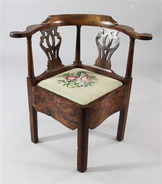 An 18th century yew wood corner chair,